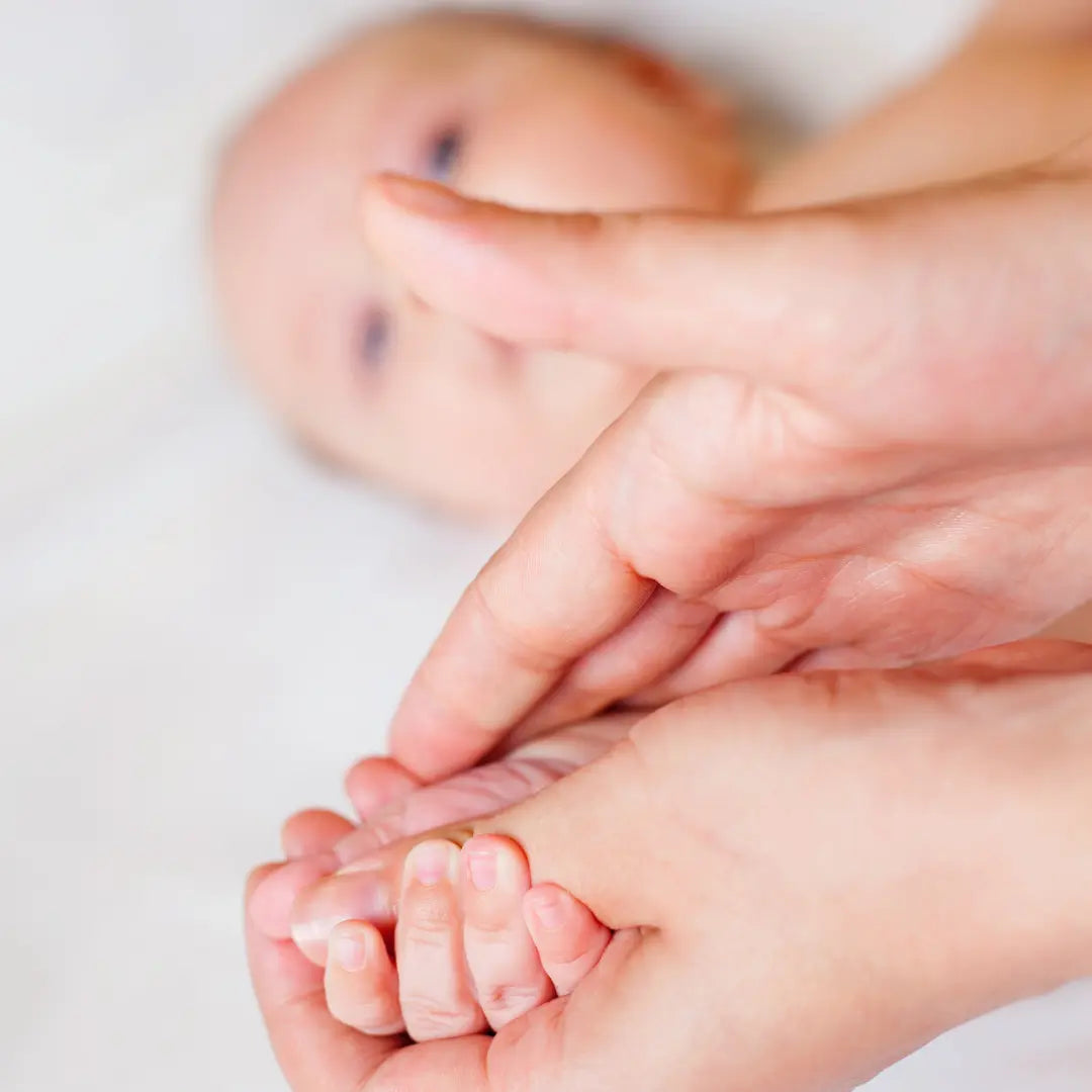 Close-up of a baby's foot being massages