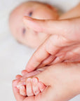 Close-up of a baby's foot being massages