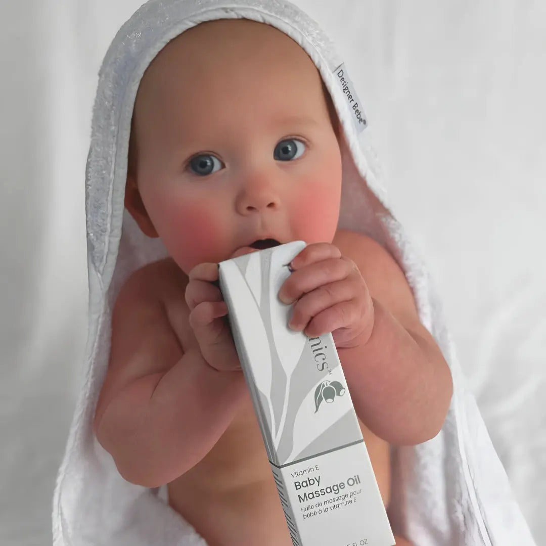 Happy baby after gentle massage using Pod Organics Vitamin E Massage Oil